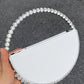 Christina rhinestone round clutch